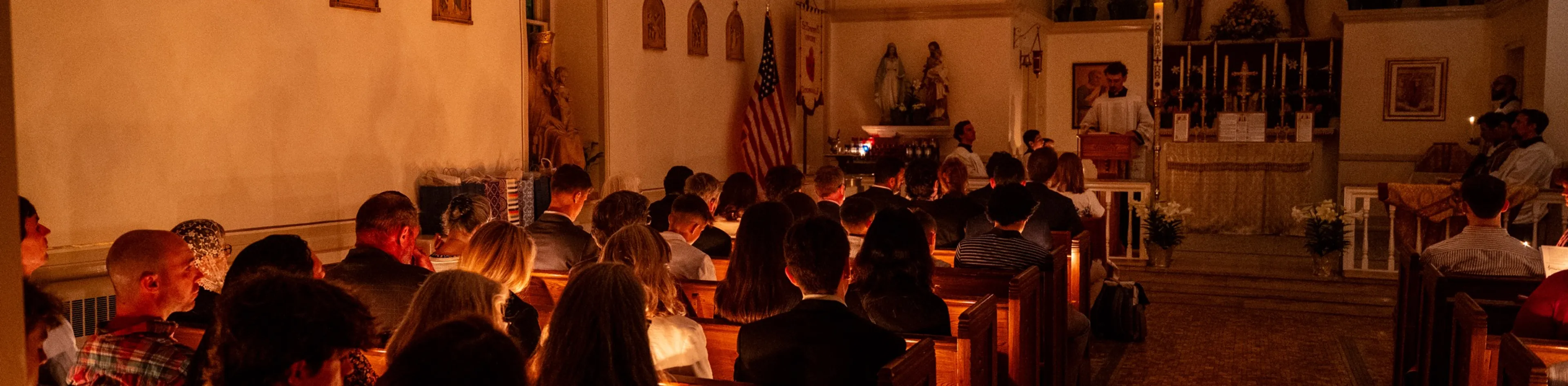 the congregation at Saint Timothys during a candlelit liturgy